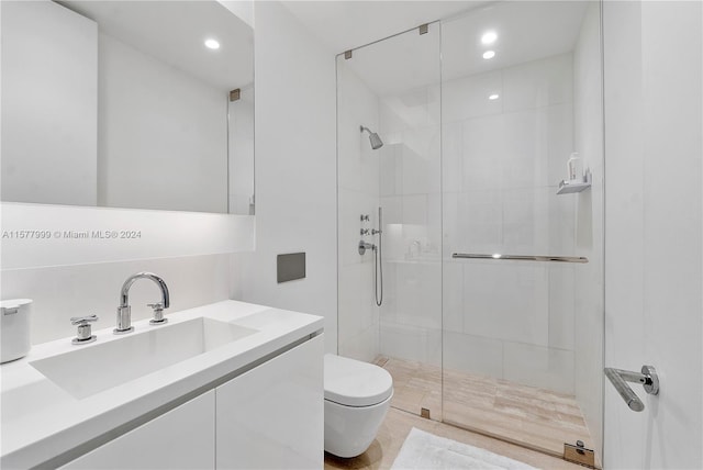 bathroom with vanity, toilet, and walk in shower