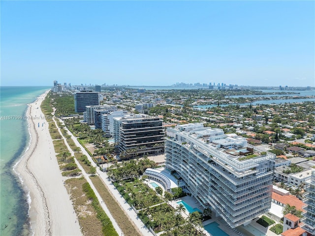 drone / aerial view with a water view and a view of the beach