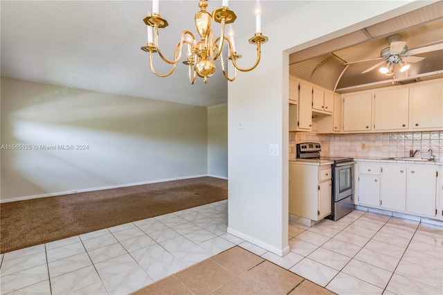 kitchen with light colored carpet, backsplash, hanging light fixtures, ceiling fan with notable chandelier, and stainless steel electric stove