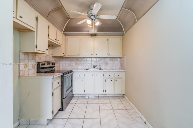 kitchen featuring ceiling fan, electric stove, sink, light tile flooring, and tasteful backsplash