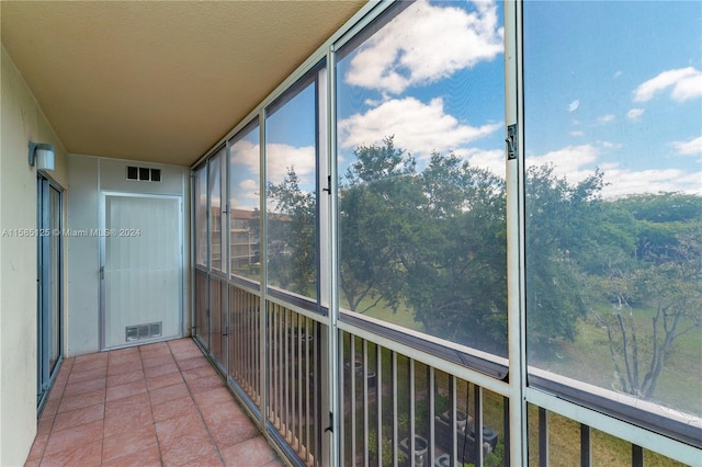 unfurnished sunroom featuring plenty of natural light