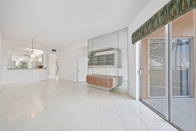 unfurnished living room with tile flooring