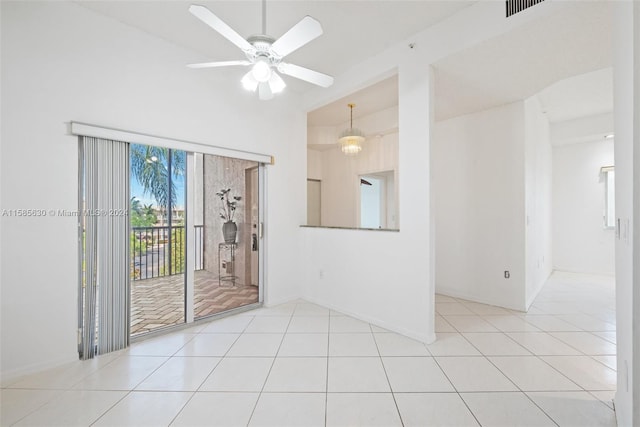 unfurnished room with ceiling fan and light tile floors