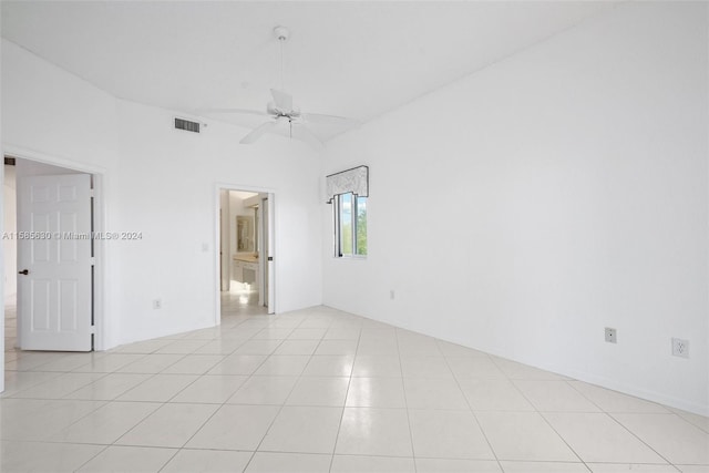 unfurnished room with ceiling fan and light tile floors