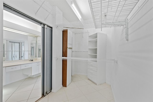 spacious closet featuring light tile floors