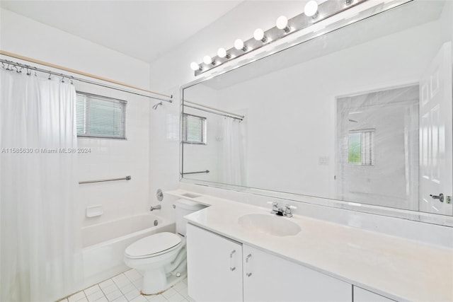 full bathroom featuring tile flooring, oversized vanity, toilet, and shower / bath combo with shower curtain