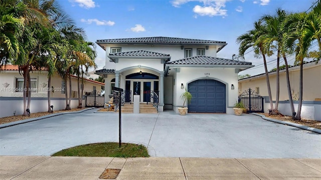 mediterranean / spanish house with a garage