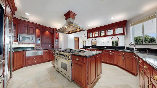 kitchen featuring island exhaust hood, appliances with stainless steel finishes, light tile flooring, and a kitchen island