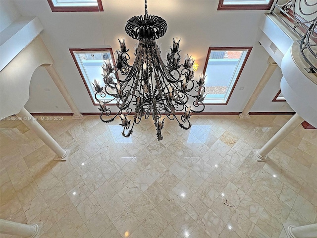 entrance foyer with a high ceiling and tile floors