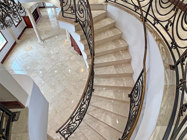 stairway featuring tile floors