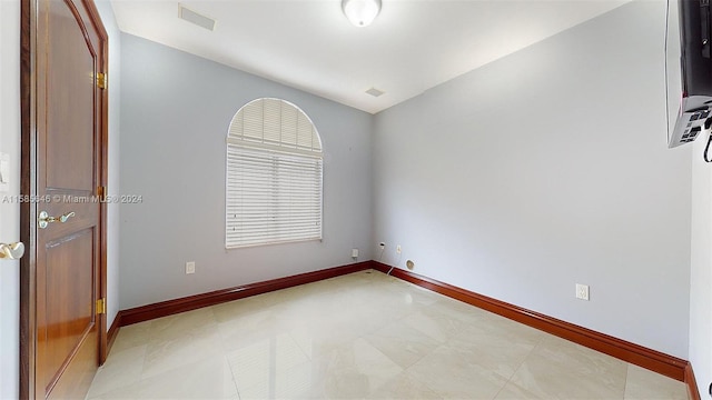 view of tiled spare room