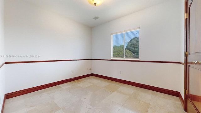 view of tiled spare room