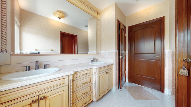 bathroom featuring tile flooring and dual bowl vanity