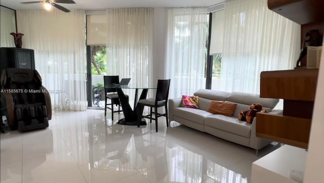 living room featuring tile floors and ceiling fan