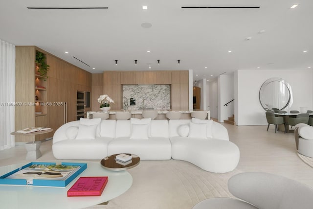 living room featuring wood walls