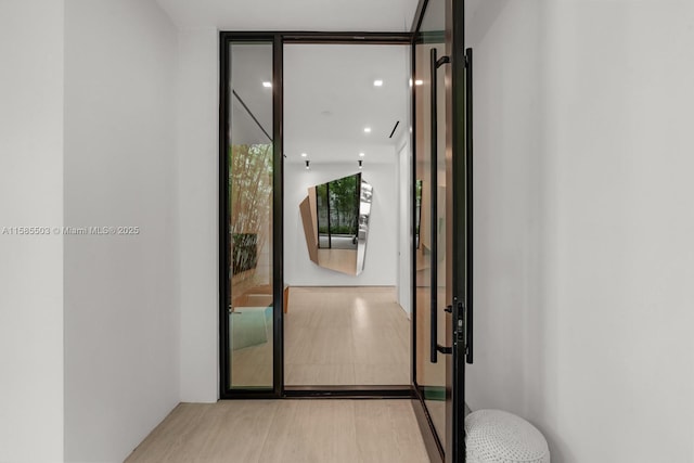 entryway with light hardwood / wood-style floors