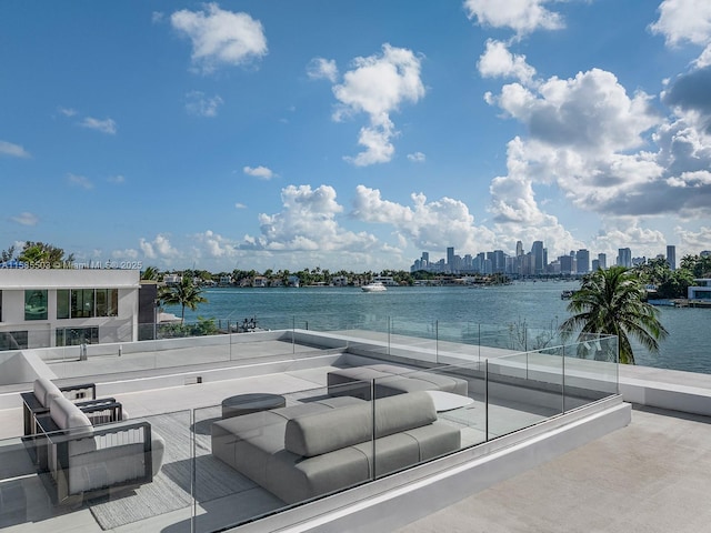 view of patio / terrace featuring outdoor lounge area and a water view