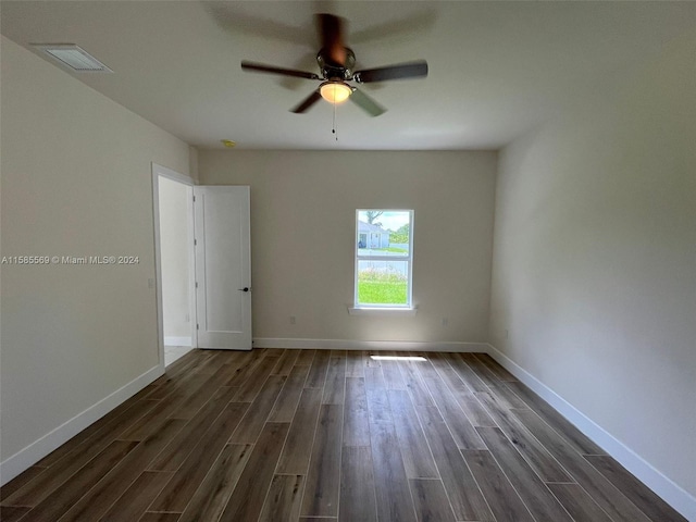 unfurnished room featuring ceiling fan and dark hardwood / wood-style floors