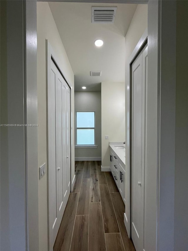 hallway featuring dark hardwood / wood-style flooring