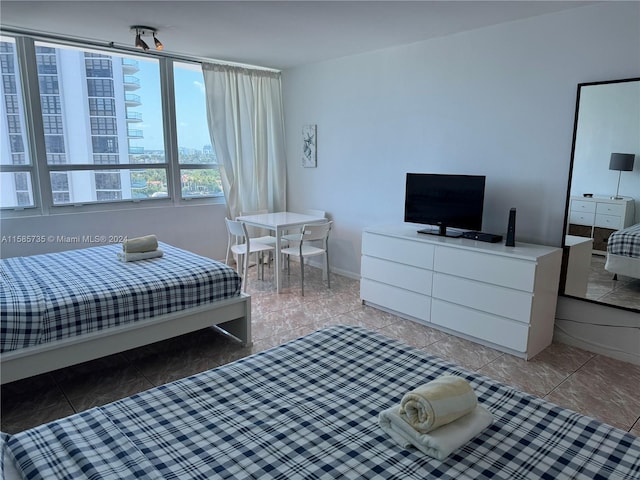 bedroom featuring tile floors