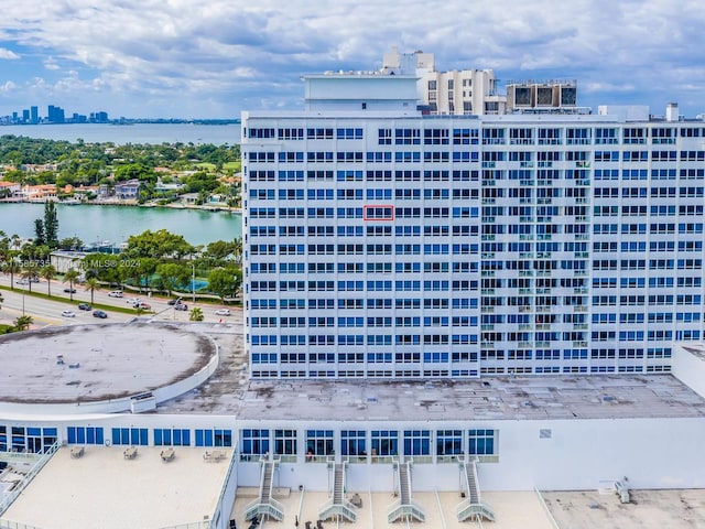 view of building exterior with a water view