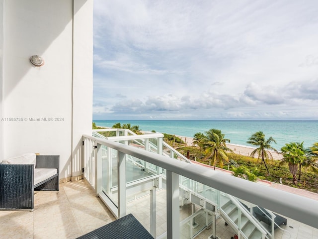 balcony featuring a water view