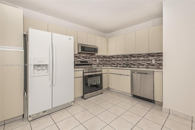 empty room with a textured ceiling and light tile patterned floors