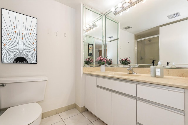 kitchen featuring cream cabinets, appliances with stainless steel finishes, tasteful backsplash, and light tile patterned floors