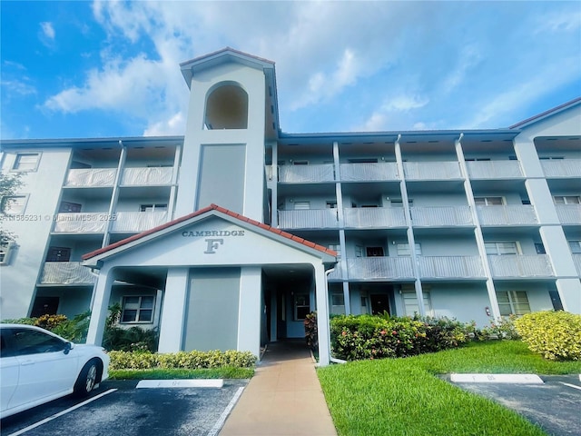 view of property with uncovered parking