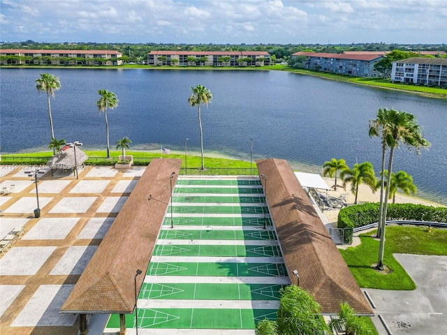 birds eye view of property with a water view