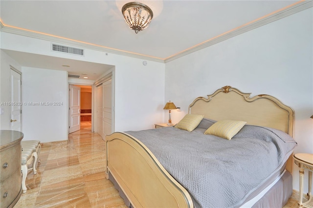 bedroom with wood-type flooring and crown molding