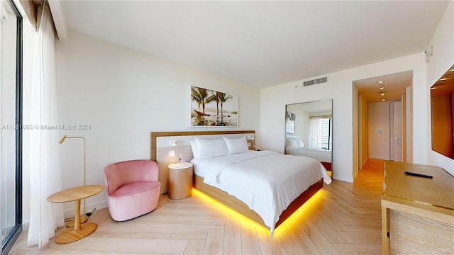 bedroom featuring light parquet floors