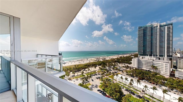 balcony with a view of the beach and a water view