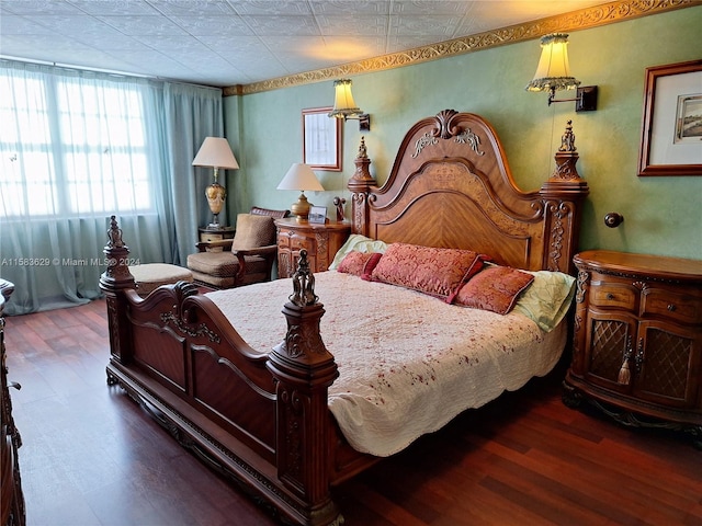 bedroom with hardwood / wood-style flooring