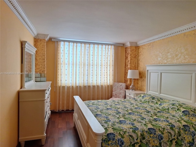 bedroom featuring crown molding and dark hardwood / wood-style flooring