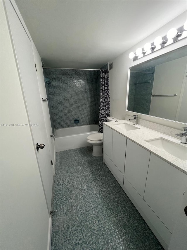 full bathroom with tile flooring, double vanity, toilet, and shower / bathtub combination with curtain