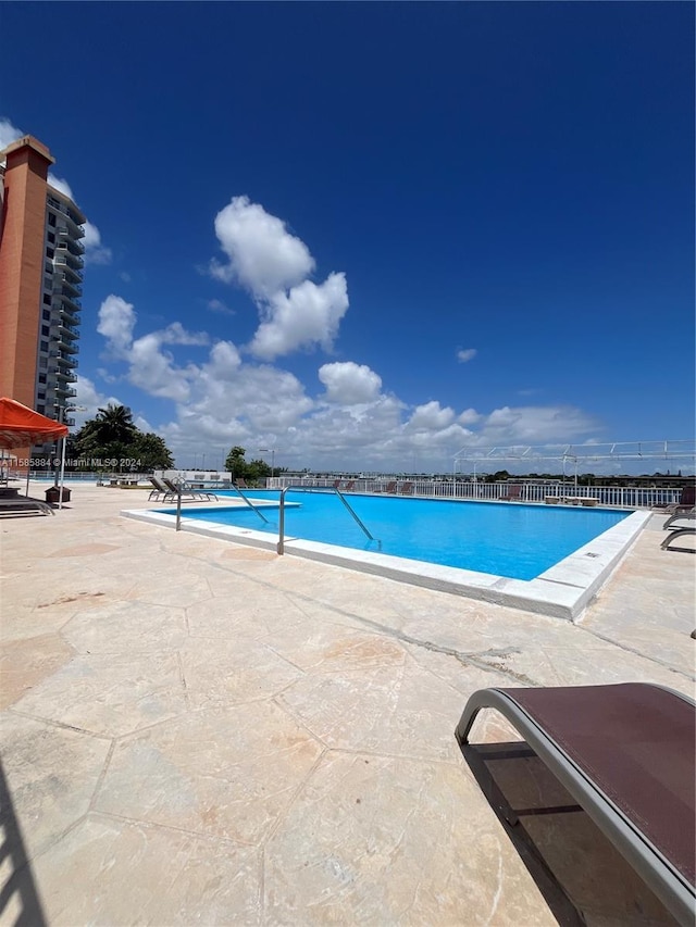 view of swimming pool featuring a patio