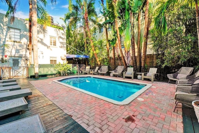view of swimming pool with a patio
