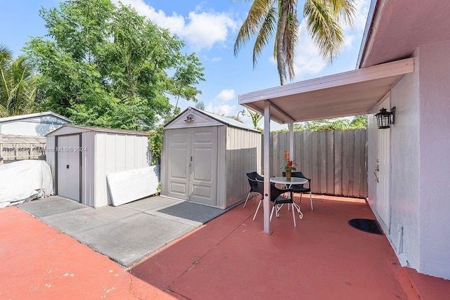 view of patio featuring a storage shed