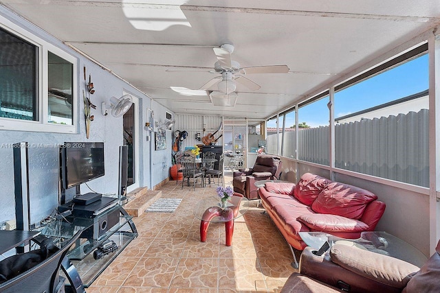 sunroom featuring ceiling fan