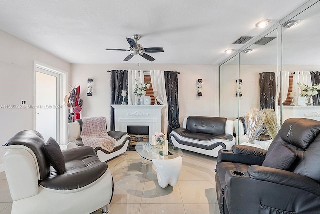 living room with ceiling fan and light tile floors