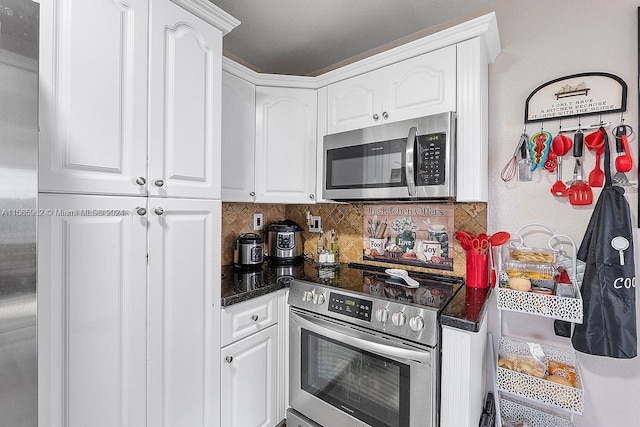 kitchen featuring white cabinetry, backsplash, and stainless steel appliances