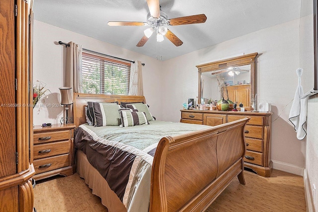 bedroom featuring ceiling fan and light hardwood / wood-style floors