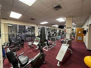 workout area with a paneled ceiling