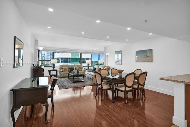 dining space with dark hardwood / wood-style flooring