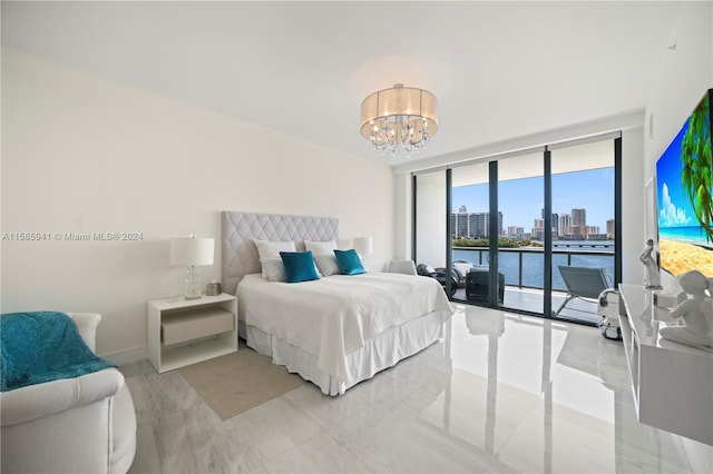 bedroom featuring access to outside, expansive windows, and a chandelier