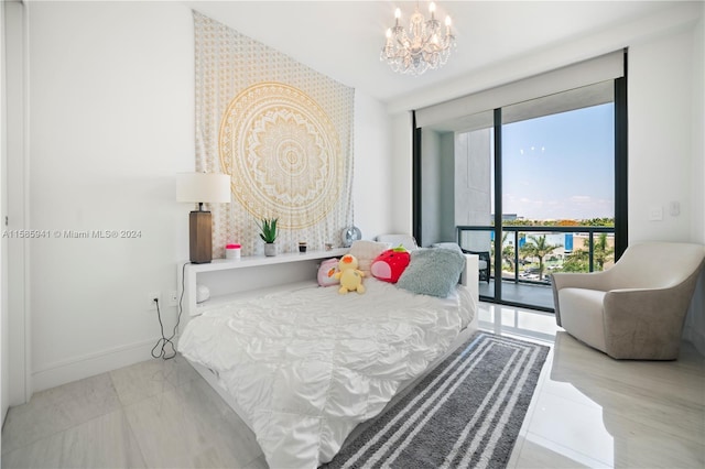 bedroom with light wood-type flooring, access to outside, and a chandelier