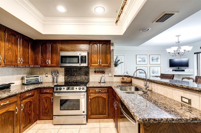 kitchen featuring appliances with stainless steel finishes, light tile patterned floors, an inviting chandelier, ornamental molding, and sink