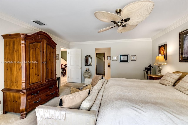 bedroom featuring ceiling fan, light colored carpet, and crown molding