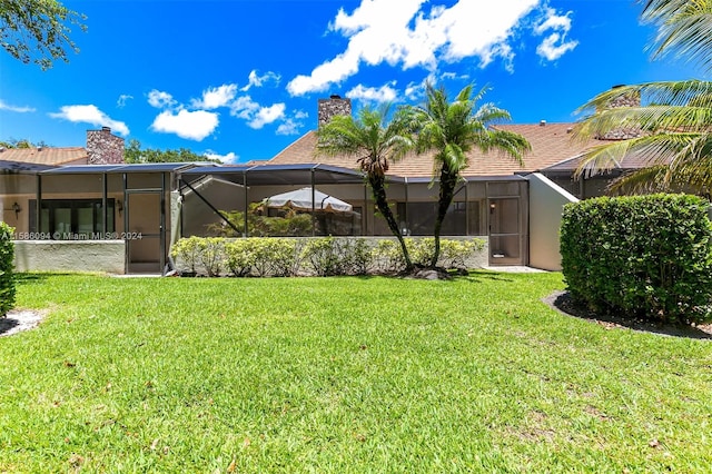 exterior space with a lawn and a lanai